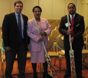 Shirley Jackson, Sandeep Nandy, and Dave Aiello with hockey sticks